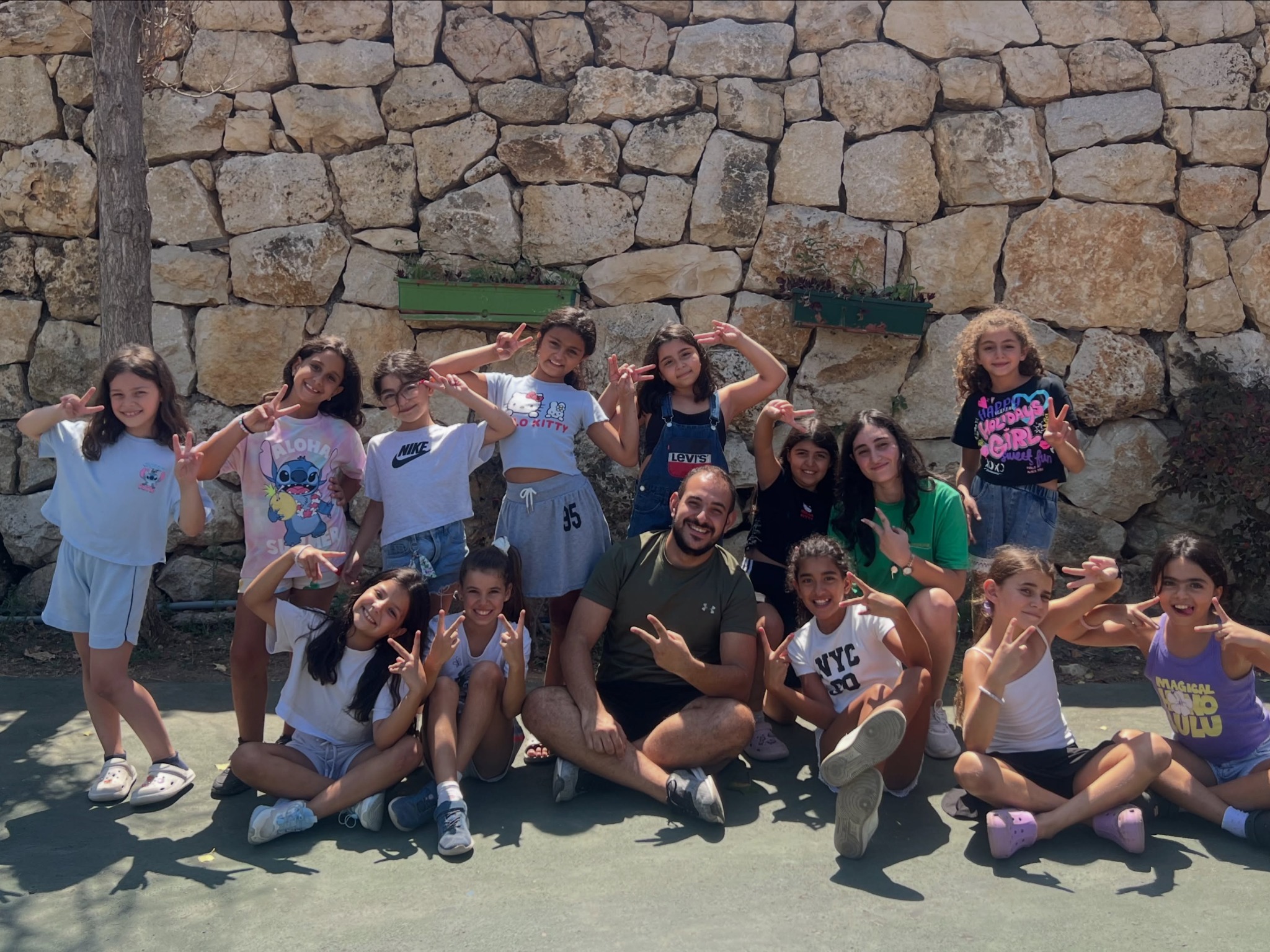 Children sharing a happy Calinou summer camp day